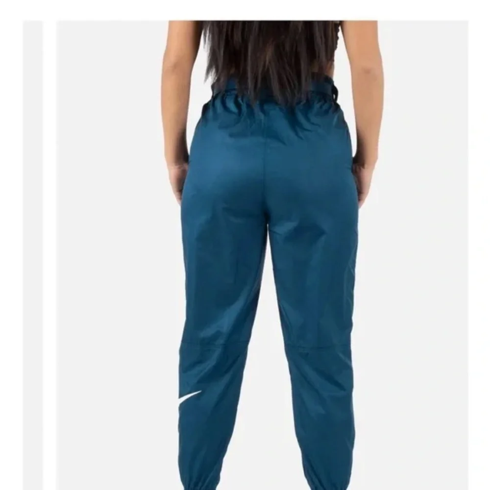 Nike Track Pants Teal Blue Polyester Joggers White Swoosh Elastic Cuffs